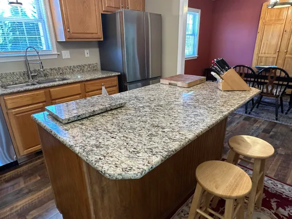 a living room with furniture a rug and a window