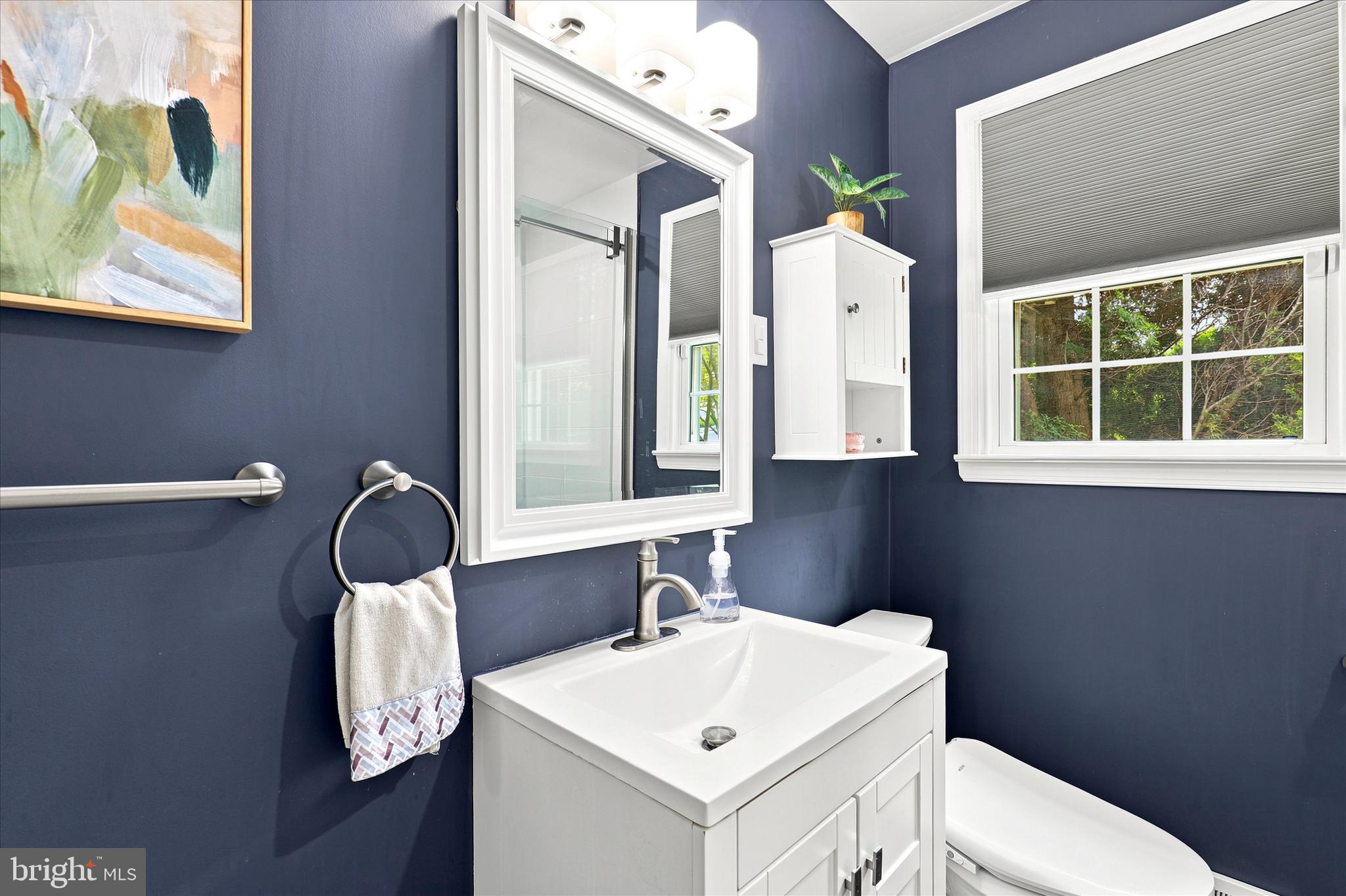 3155 Manor Road Huntingdon Valley, PA 19006 - Photo 22 of 31 a bathroom with a sink vanity mirror and toilet