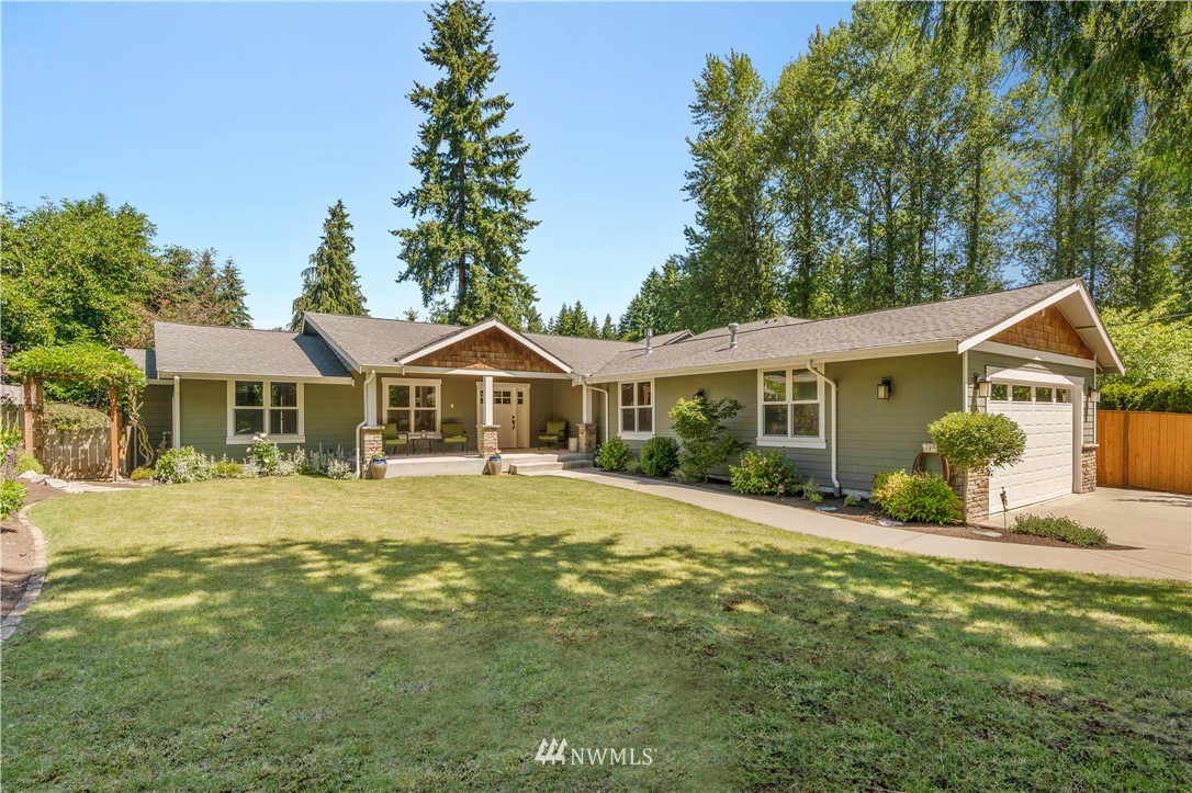 5 Winesap Road Bothell, WA 98012 - Photo 1 of 25 a front view of a house with a yard