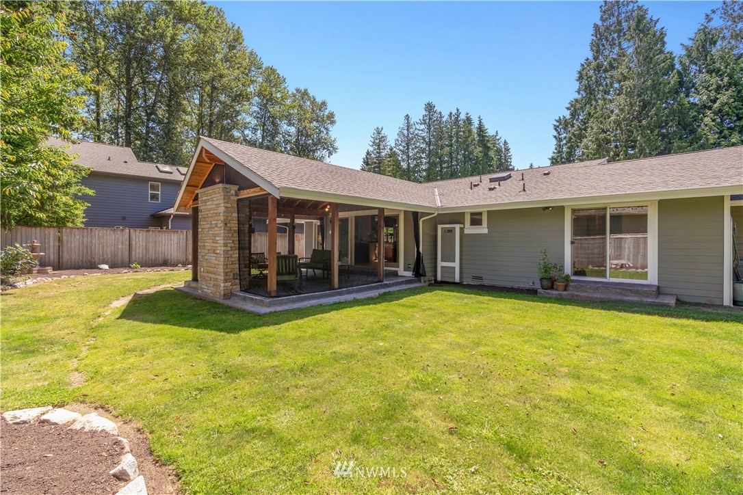 5 Winesap Road Bothell, WA 98012 - Photo 25 of 25 a view of a house with a backyard patio and swimming pool
