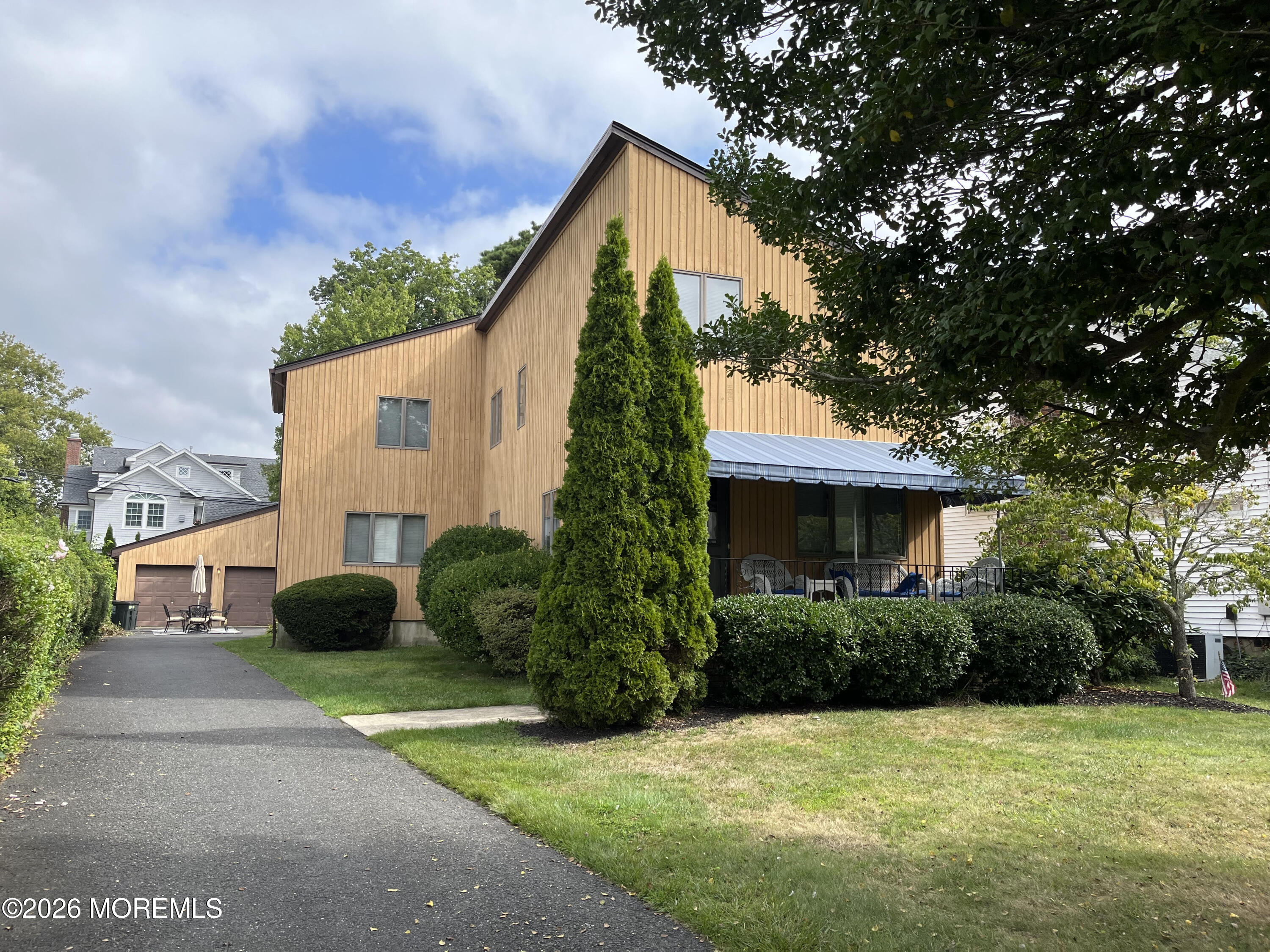 a front view of a house with garden