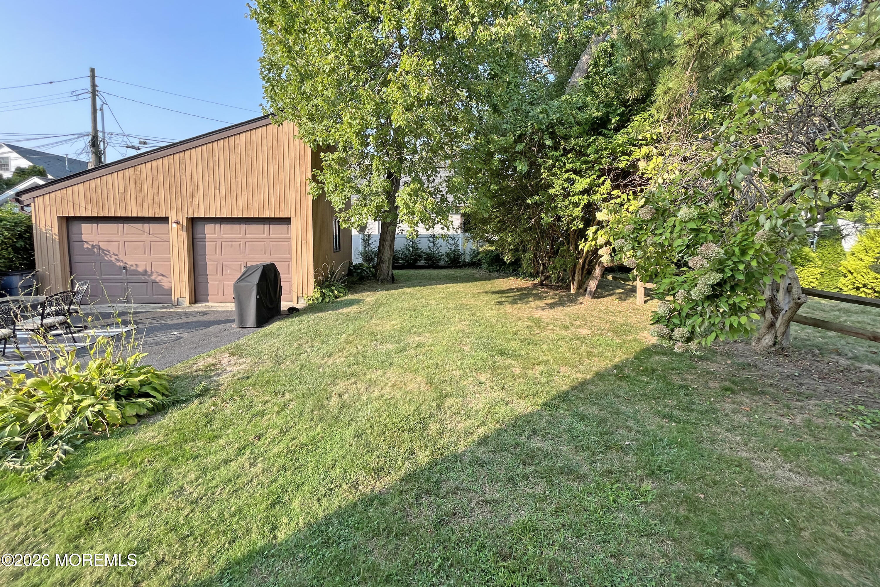 416 Salem Avenue Spring Lake, NJ 07762 - Photo 14 of 20 a backyard of a house with table and chairs