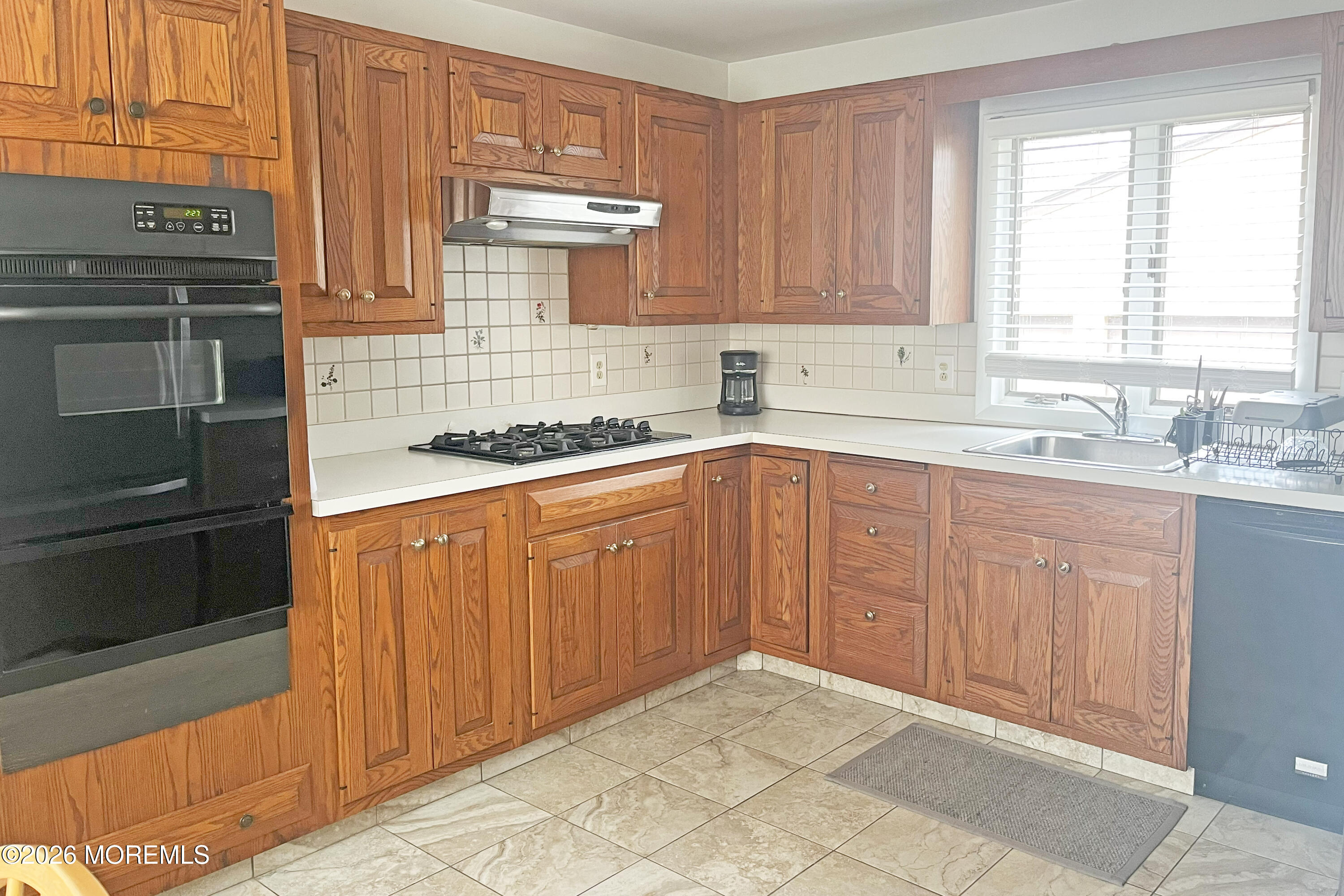 416 Salem Avenue Spring Lake, NJ 07762 - Photo 6 of 20 a kitchen with stainless steel appliances granite countertop a sink stove and cabinets