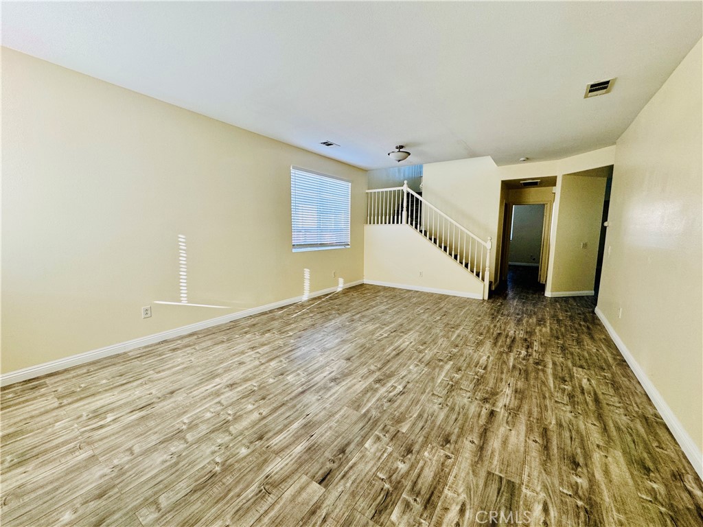 9329 Sable Ridge Avenue Hesperia, CA 92345 - Photo 13 of 31 a view of a room with wooden floor