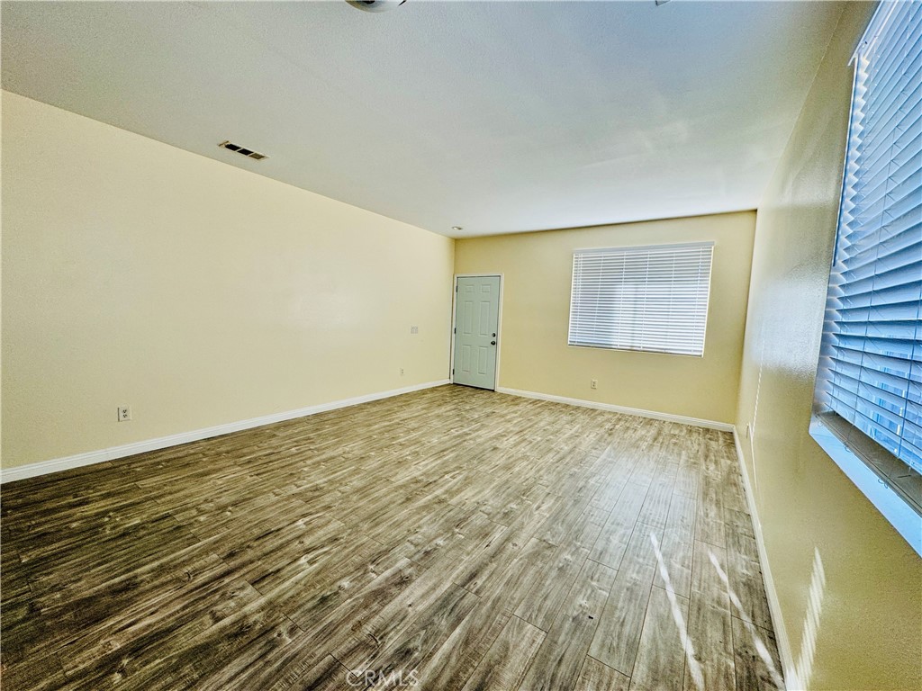 9329 Sable Ridge Avenue Hesperia, CA 92345 - Photo 14 of 31 wooden floor in an empty room