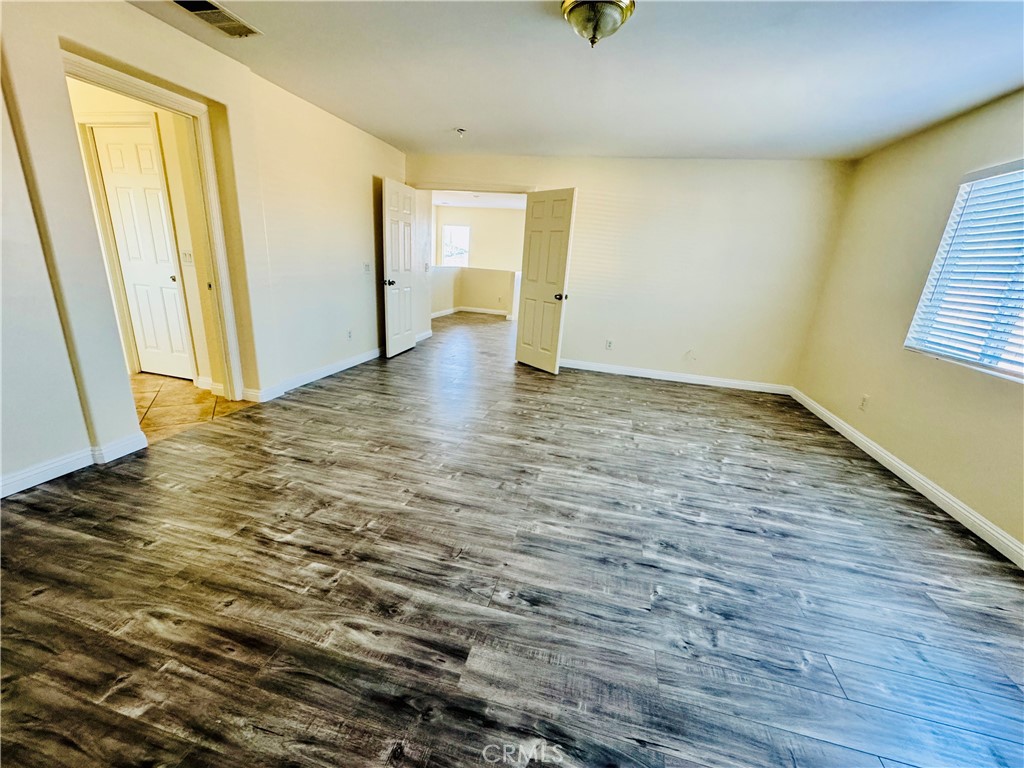 9329 Sable Ridge Avenue Hesperia, CA 92345 - Photo 24 of 31 a view of an empty room and window