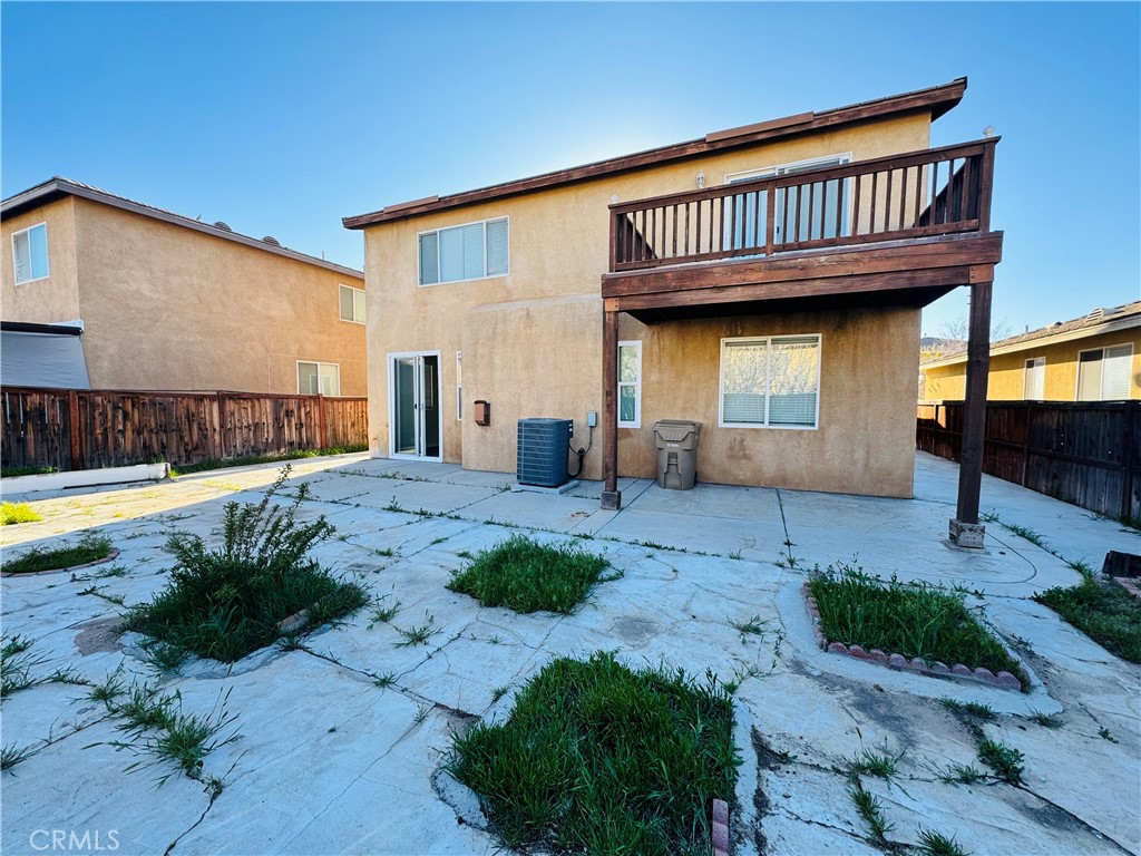 9329 Sable Ridge Avenue Hesperia, CA 92345 - Photo 31 of 31 a view of a house with a yard and sitting area