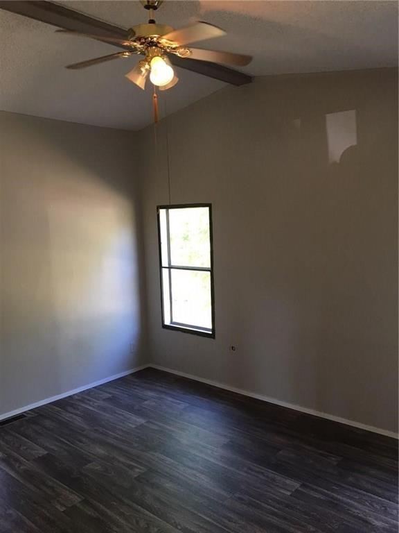 365 Darrell Road Roanoke, TX 76262 - Photo 12 of 22 Wood-finish flooring, single window, sloped ceiling, and ceiling fan with integrated lighting