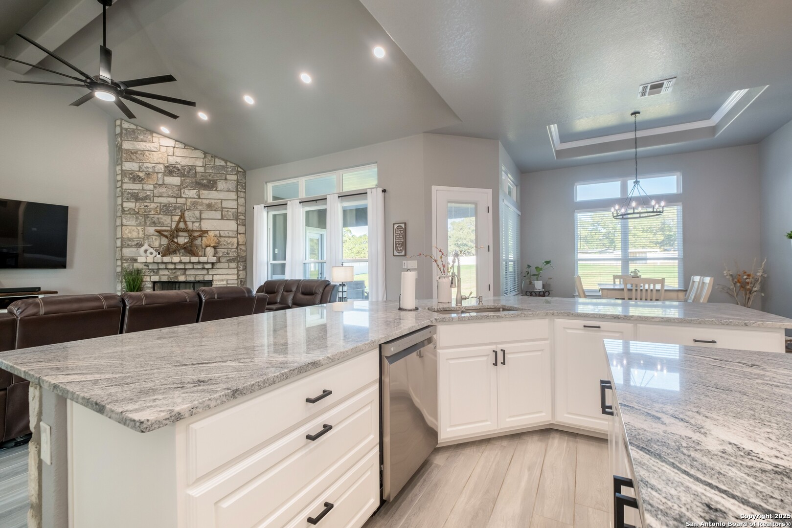 108 Timber Heights La Vernia, TX 78121 - Photo 14 of 42 a kitchen with granite countertop a sink stainless steel appliances and cabinets