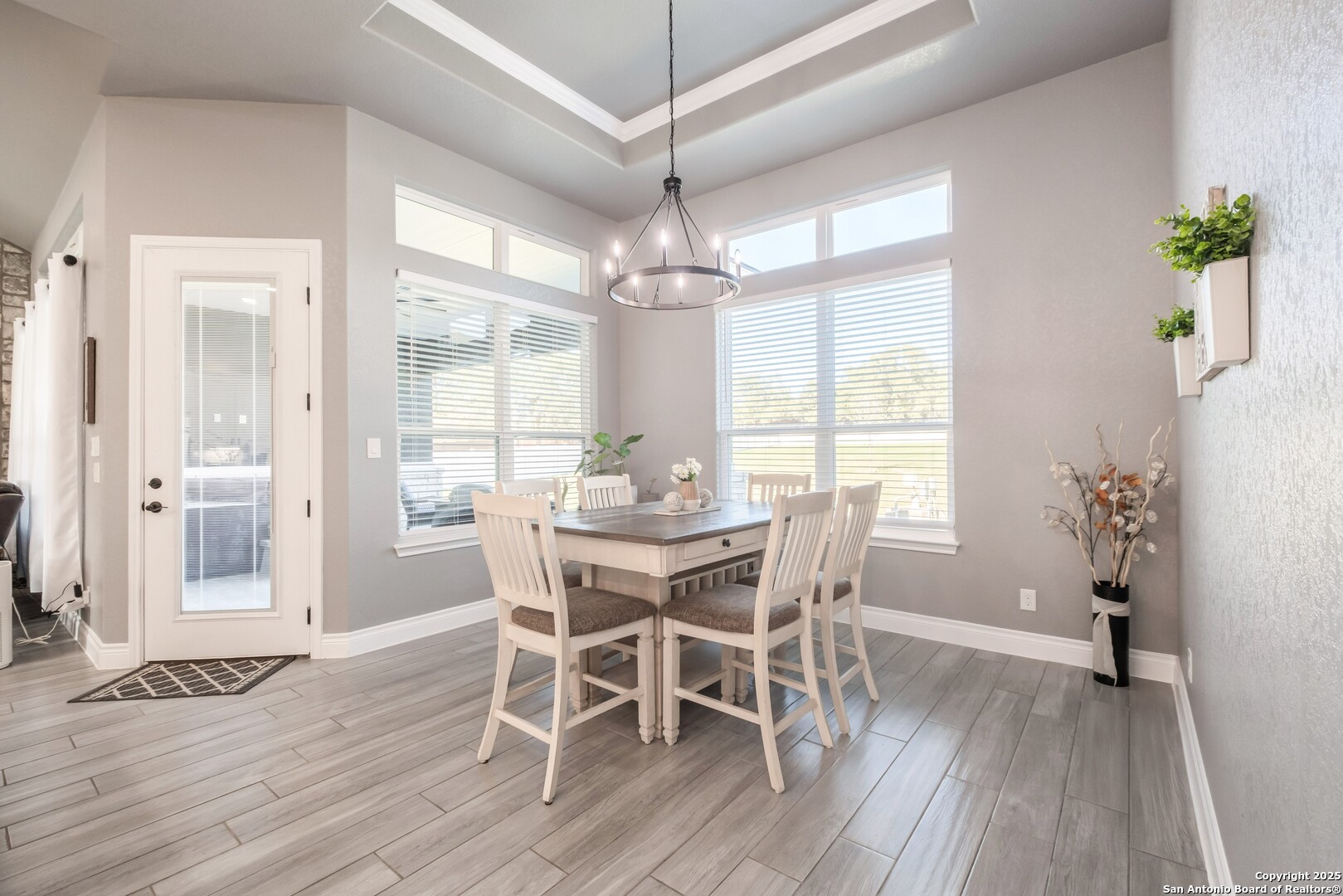 108 Timber Heights La Vernia, TX 78121 - Photo 17 of 42 a view of a dining room with furniture window and wooden floor