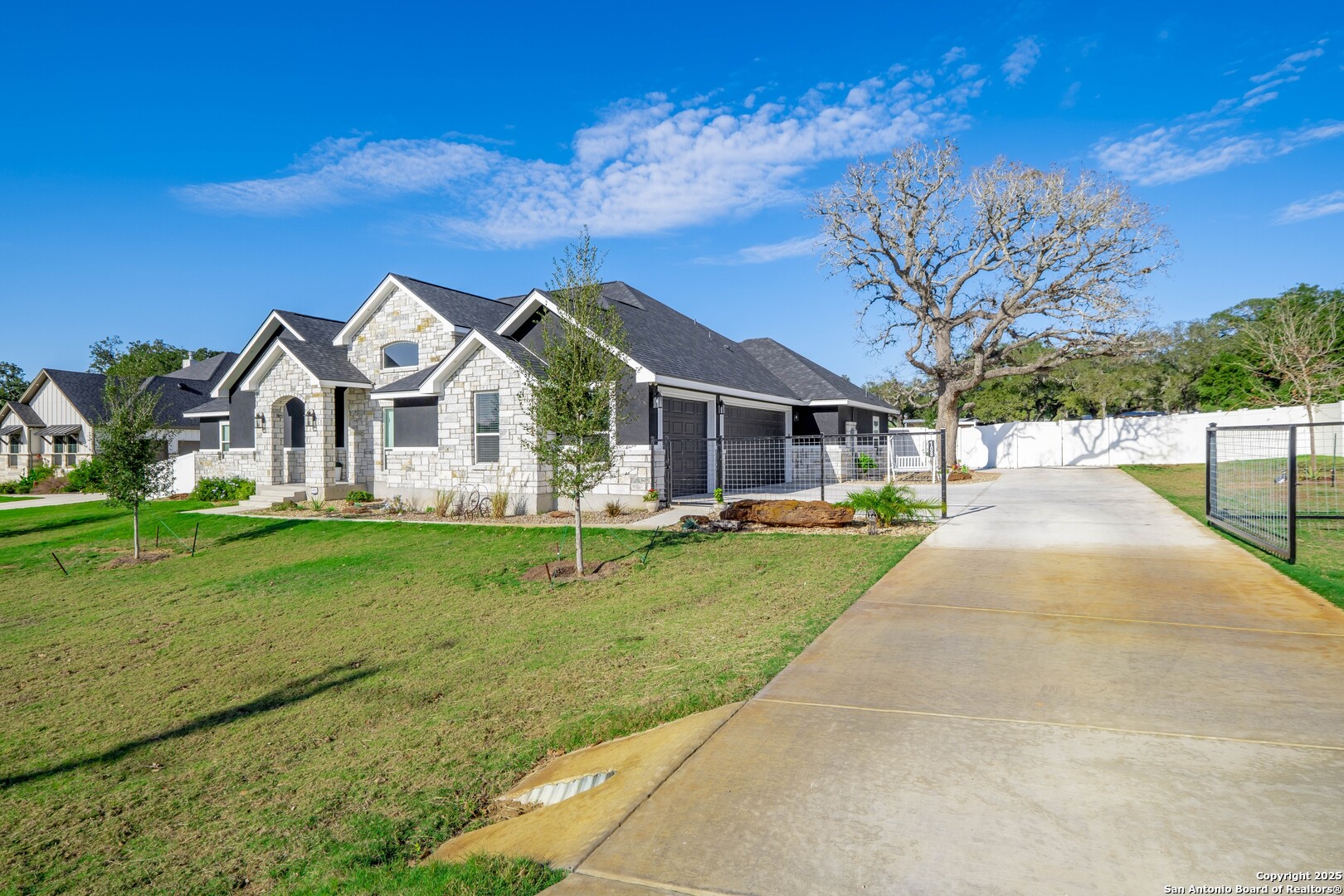 108 Timber Heights La Vernia, TX 78121 - Photo 2 of 42 a front view of a house with garden