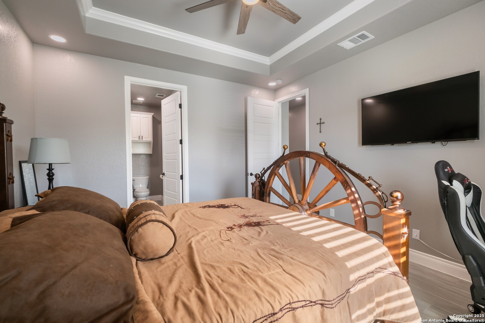 108 Timber Heights La Vernia, TX 78121 - Photo 28 of 42 a bedroom with a bed and a flat screen tv