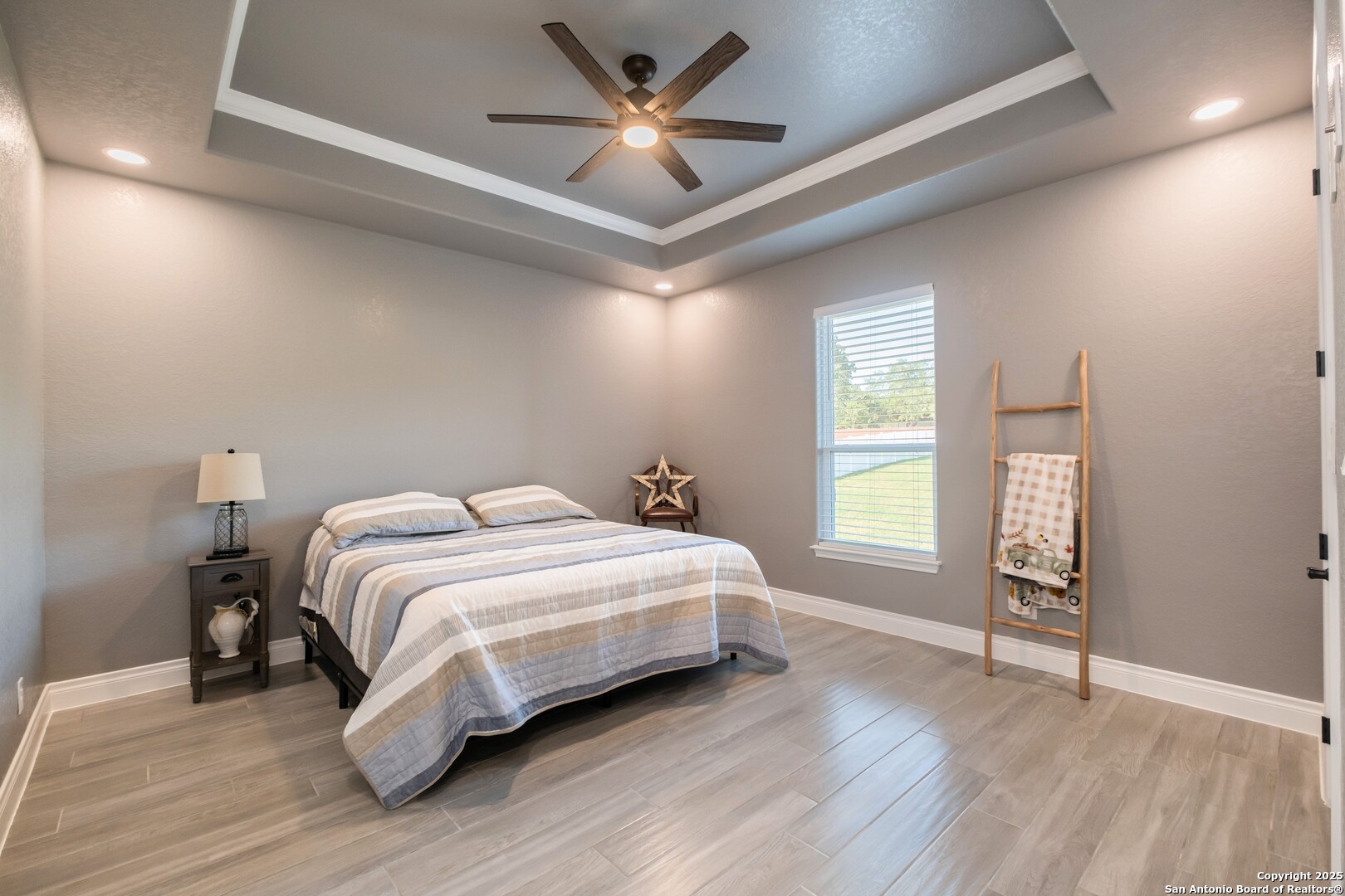 108 Timber Heights La Vernia, TX 78121 - Photo 30 of 42 a bedroom with a bed and a ceiling fan