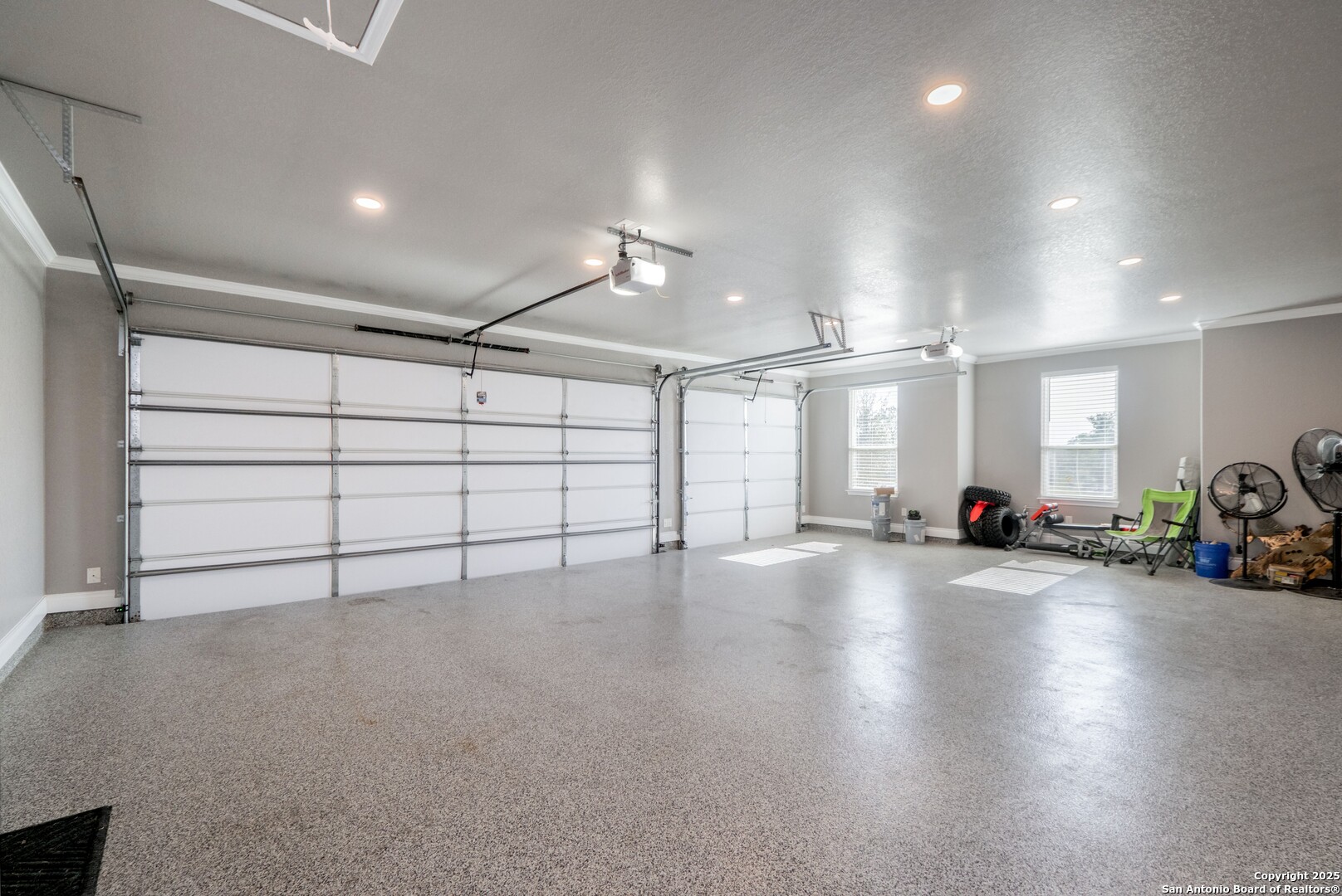 108 Timber Heights La Vernia, TX 78121 - Photo 33 of 42 an empty room with windows and ceiling fan