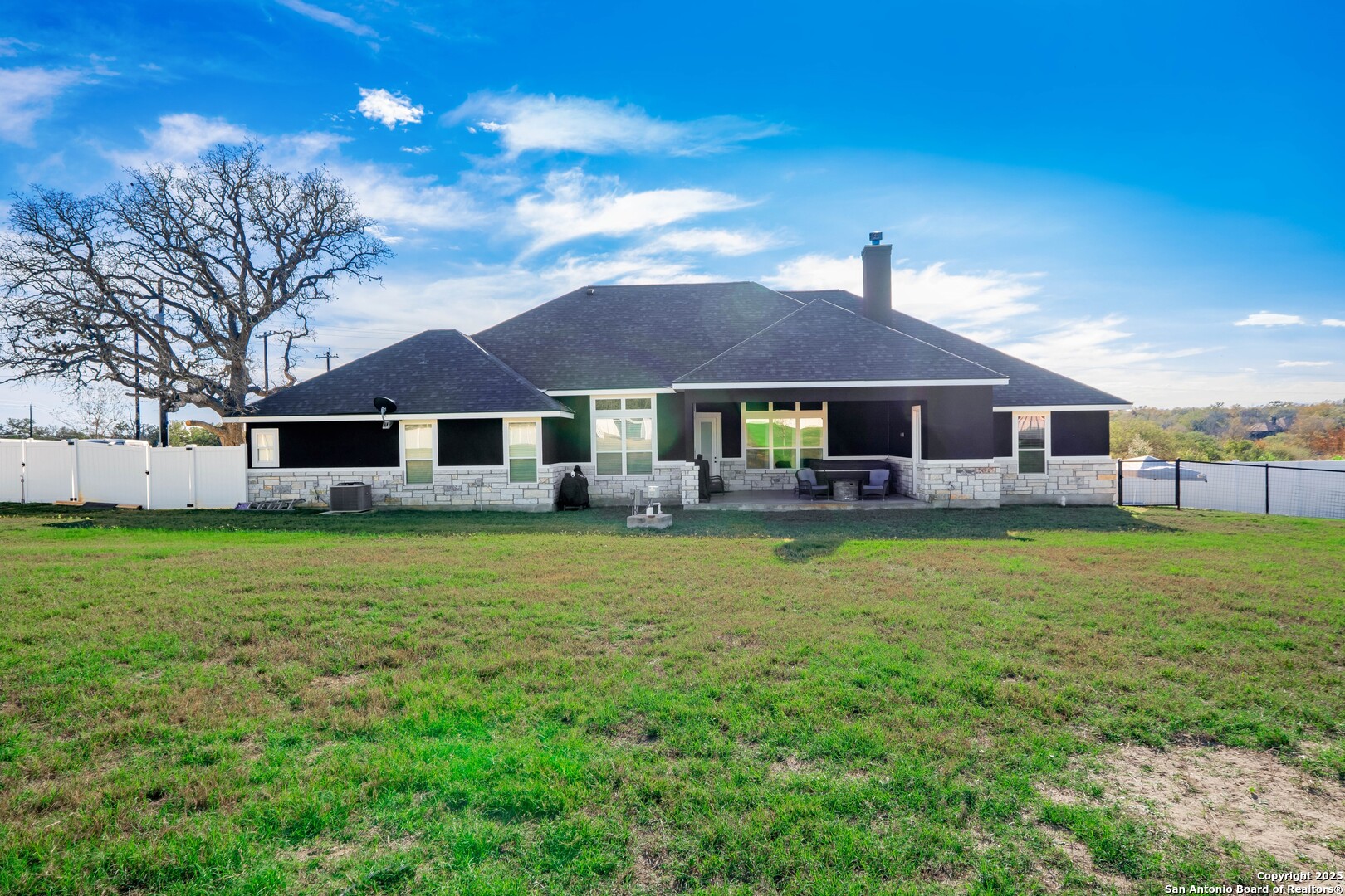 108 Timber Heights La Vernia, TX 78121 - Photo 38 of 42 a front view of a house with a garden