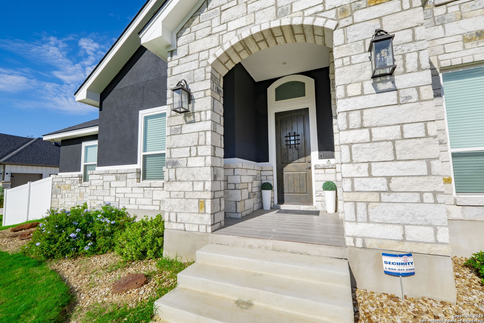 108 Timber Heights La Vernia, TX 78121 - Photo 5 of 42 a front view of a house with a garden