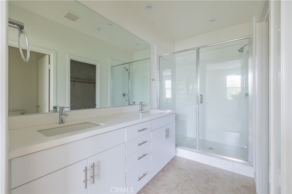 24 Prominence Lake Forest, CA 92630 - Photo 13 of 31 a bathroom with double sink and a mirror