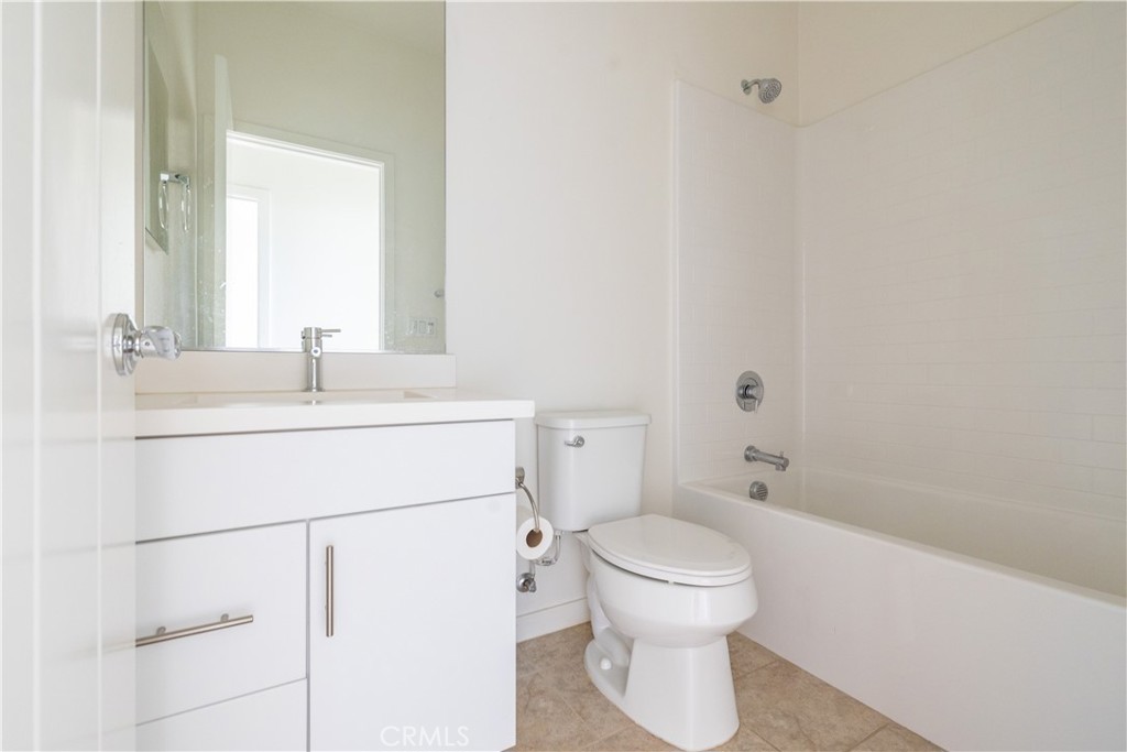 24 Prominence Lake Forest, CA 92630 - Photo 23 of 31 a bathroom with a sink toilet and shower