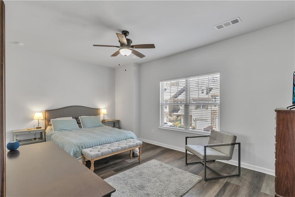 265 Valley Crossing Canton, GA 30114 - Photo 14 of 31 a bedroom with a bed a table and chair