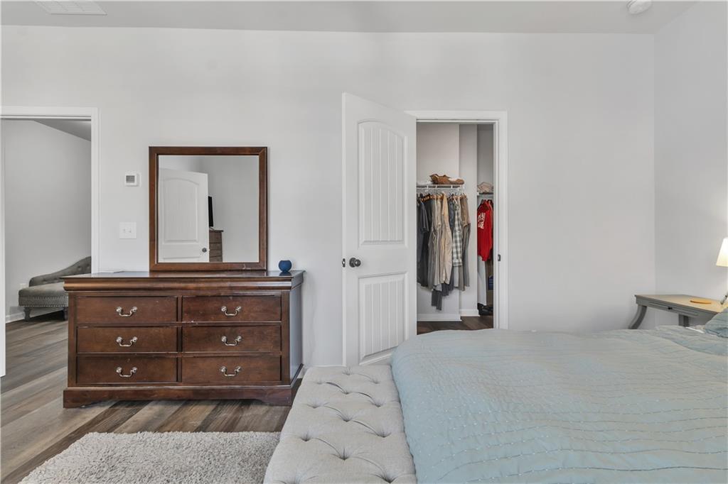 265 Valley Crossing Canton, GA 30114 - Photo 19 of 31 a bedroom with a bed and a dresser