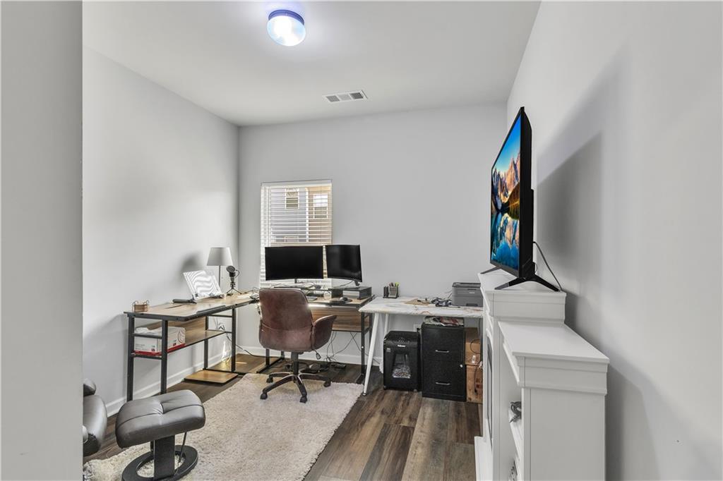 265 Valley Crossing Canton, GA 30114 - Photo 21 of 31 a view of a workspace with furniture and a window