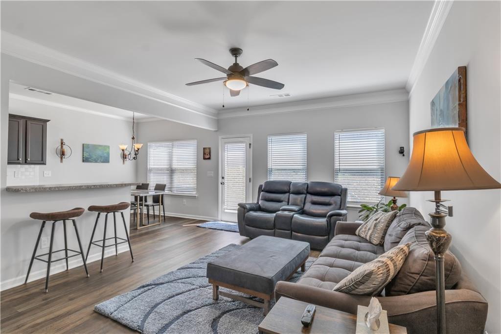265 Valley Crossing Canton, GA 30114 - Photo 3 of 31 a living room with furniture a lamp and a window
