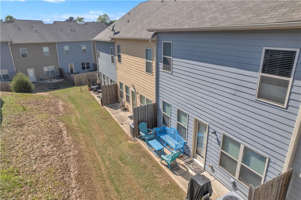 265 Valley Crossing Canton, GA 30114 - Photo 31 of 31 a view of a patio with couches chairs and potted plants