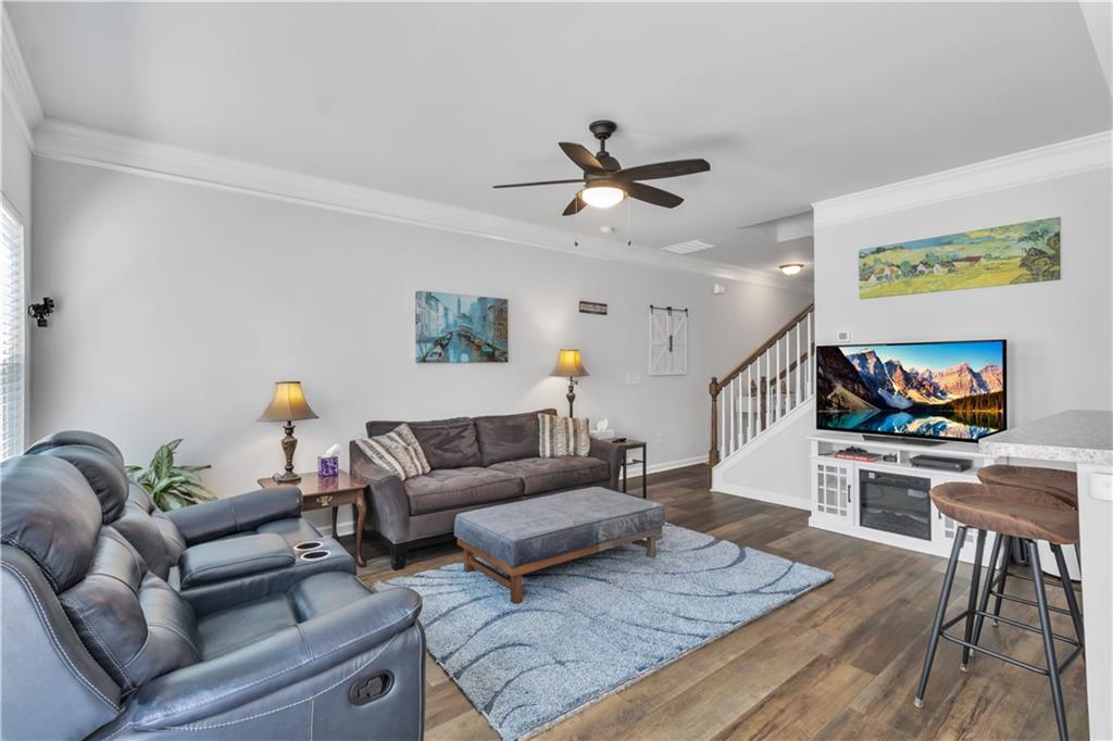 265 Valley Crossing Canton, GA 30114 - Photo 6 of 31 a living room with furniture and a flat screen tv