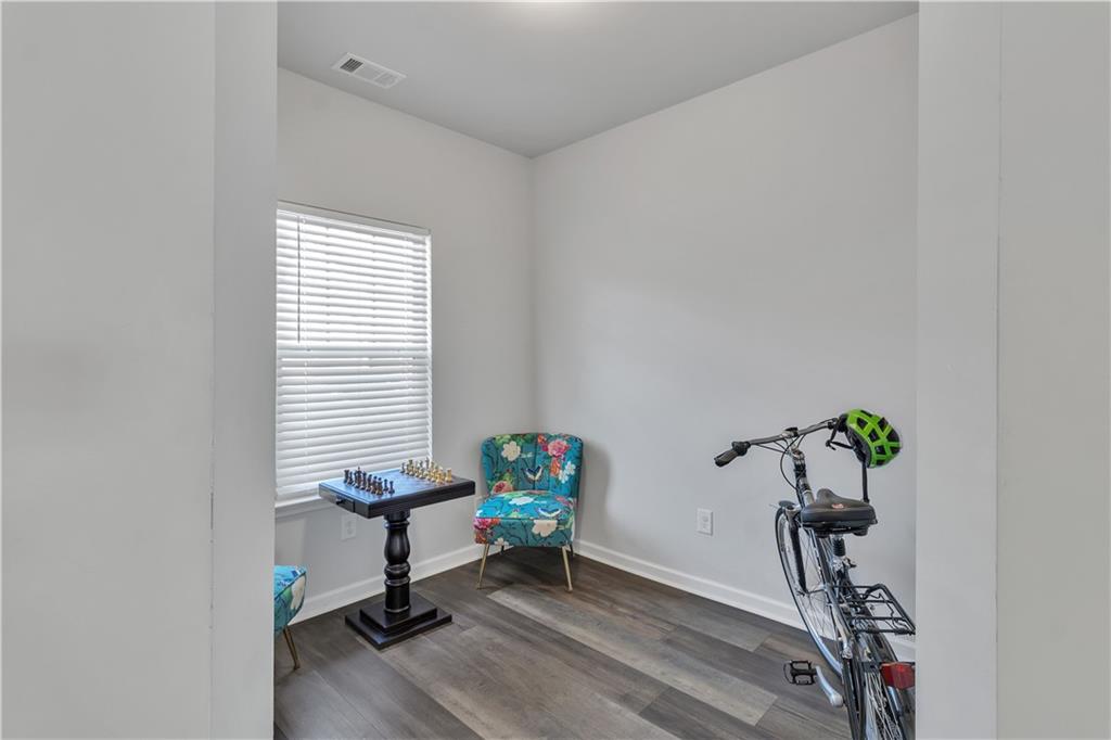 265 Valley Crossing Canton, GA 30114 - Photo 8 of 31 a view of a workspace with furniture and a window