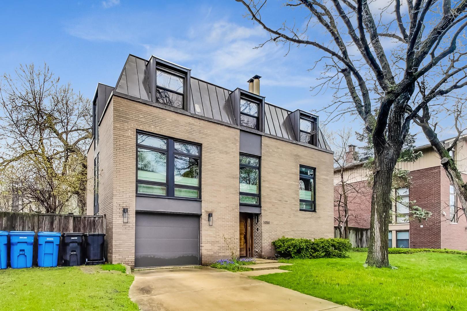 1050 East 49th Street Chicago, IL 60615 - Photo 1 of 1 a front view of a house with garden