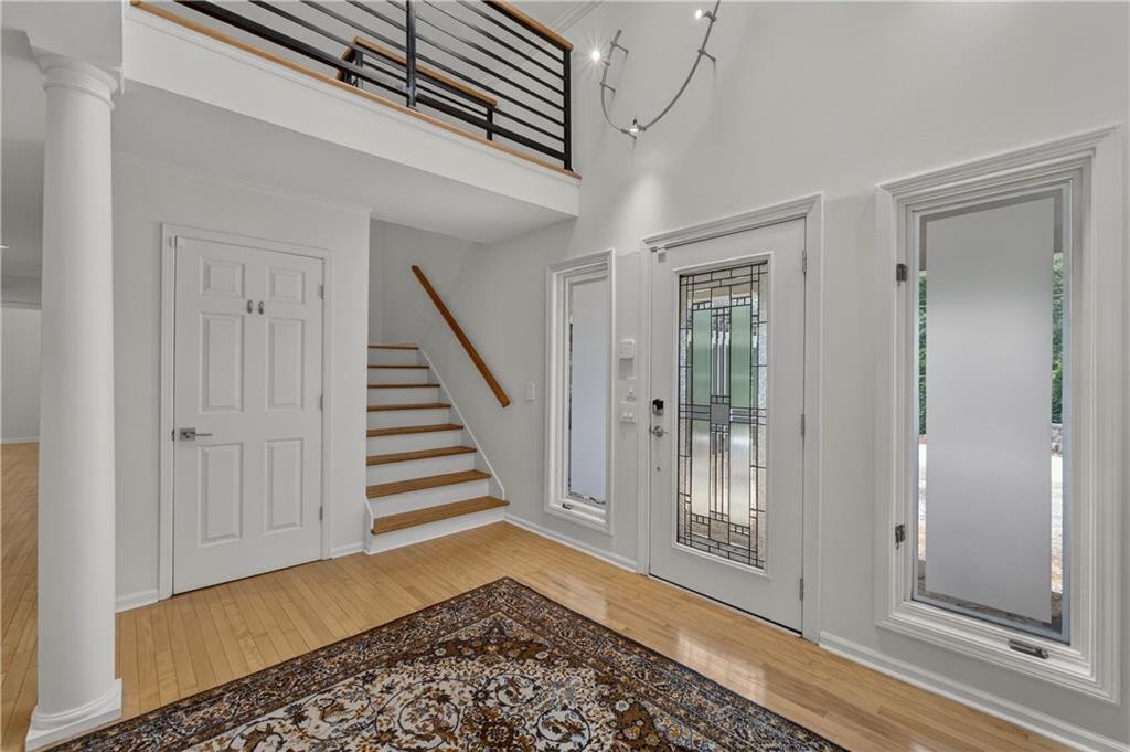 4610 West Morton Road Alpharetta, GA 30022 - Photo 7 of 53 a view of a hallway with wooden floor and entryway