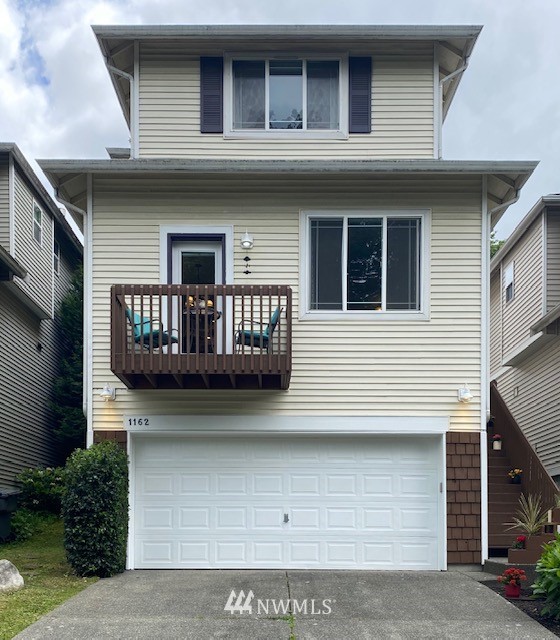 1162 Edmonds Place Northeast Renton, WA 98056 - Photo 1 of 25 a front view of a house with a yard