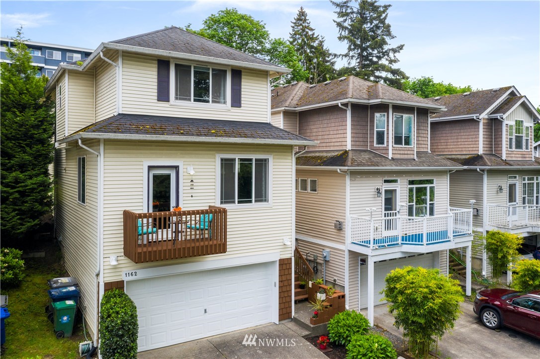 1162 Edmonds Place Northeast Renton, WA 98056 - Photo 2 of 25 a front view of a house with garden