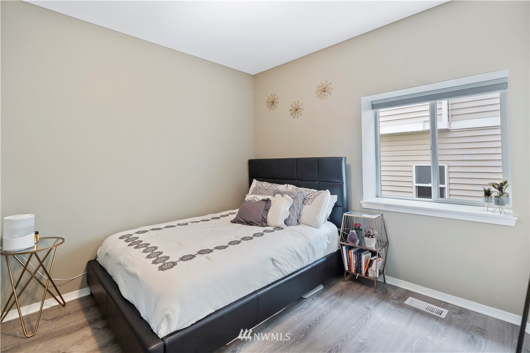 1162 Edmonds Place Northeast Renton, WA 98056 - Photo 15 of 25 a bedroom with a bed and a window