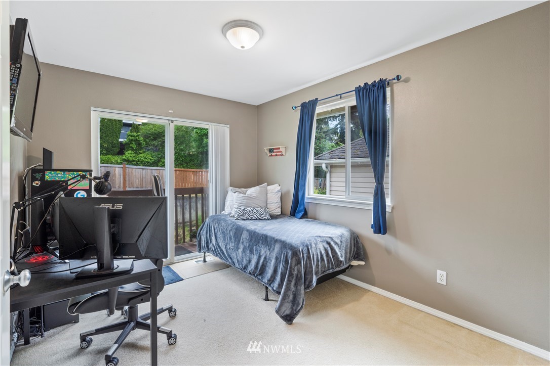 1162 Edmonds Place Northeast Renton, WA 98056 - Photo 16 of 25 a bedroom with a bed and large windows