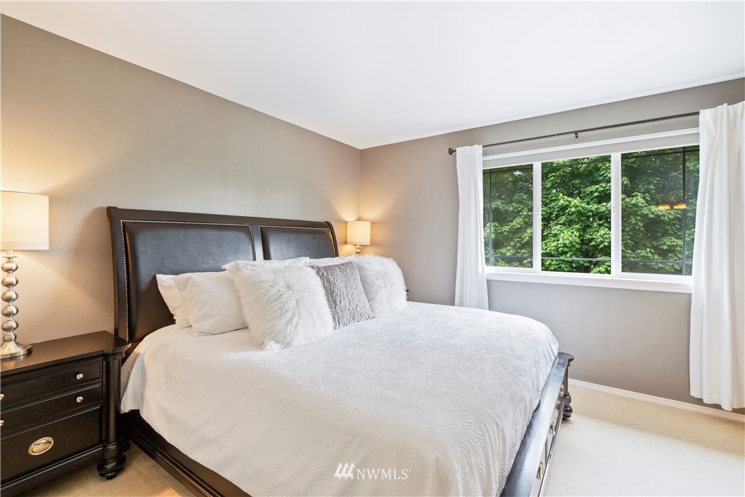 1162 Edmonds Place Northeast Renton, WA 98056 - Photo 17 of 25 a bedroom with a bed and a window