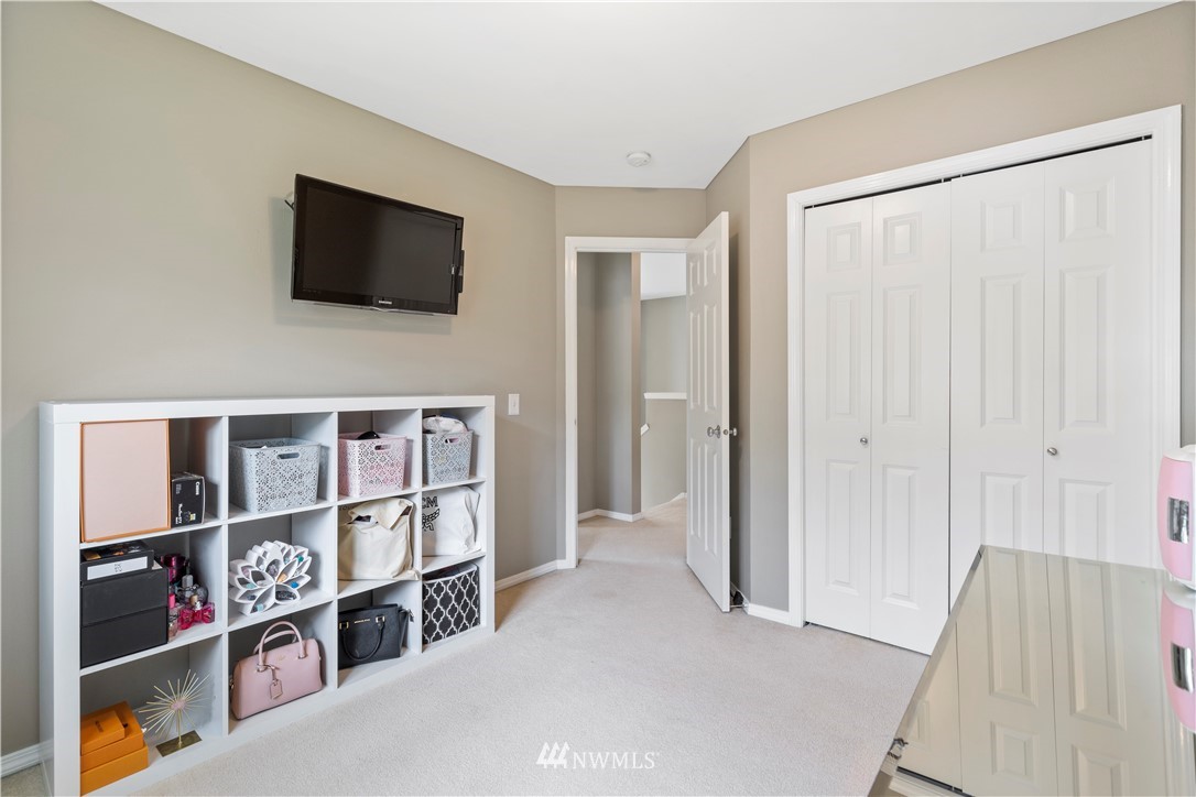 1162 Edmonds Place Northeast Renton, WA 98056 - Photo 21 of 25 a view of a livingroom with shelves