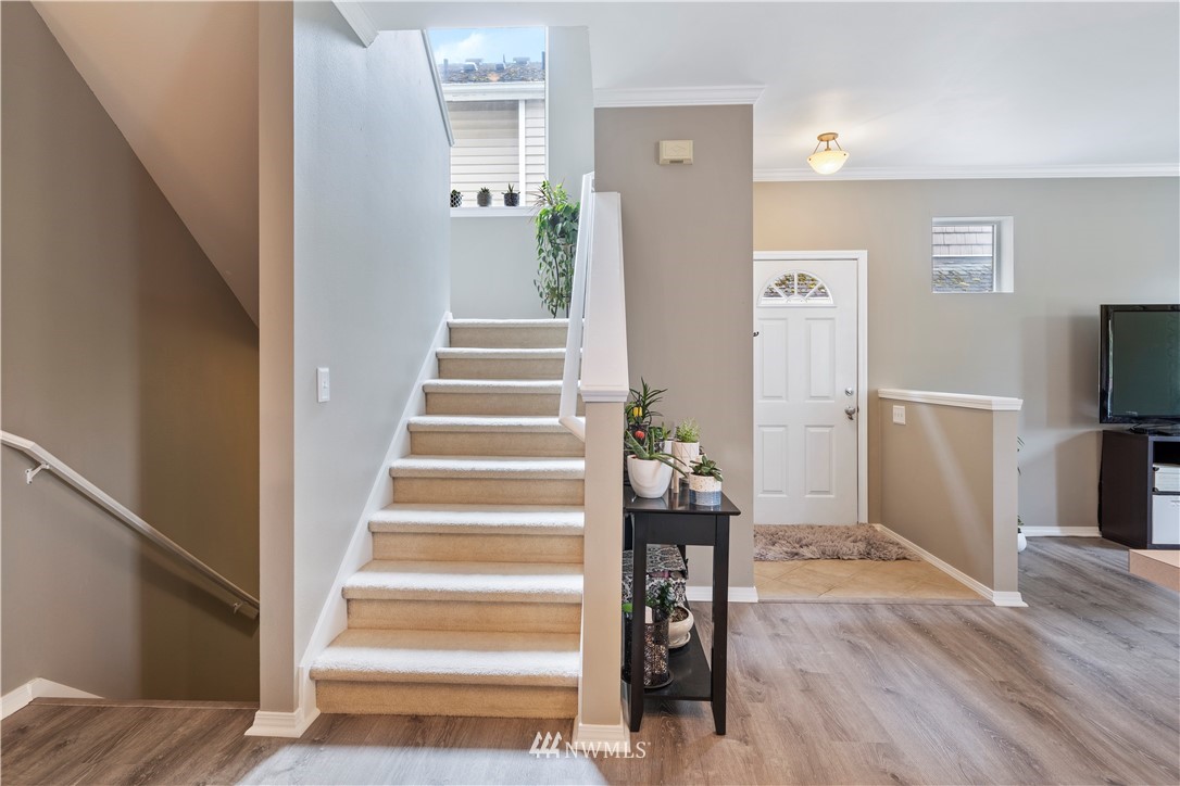 1162 Edmonds Place Northeast Renton, WA 98056 - Photo 22 of 25 a view of entryway and hall with wooden floor