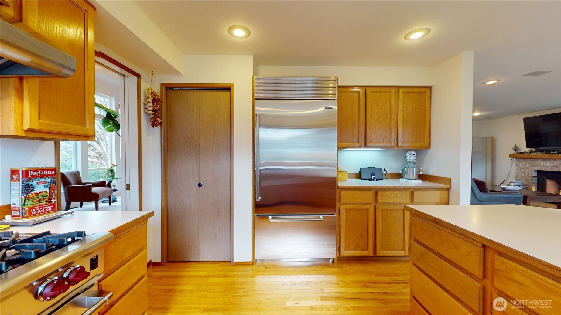 1704 Field Place Northeast Renton, WA 98059 - Photo 11 of 38 a kitchen with stainless steel appliances granite countertop a sink a stove and a refrigerator
