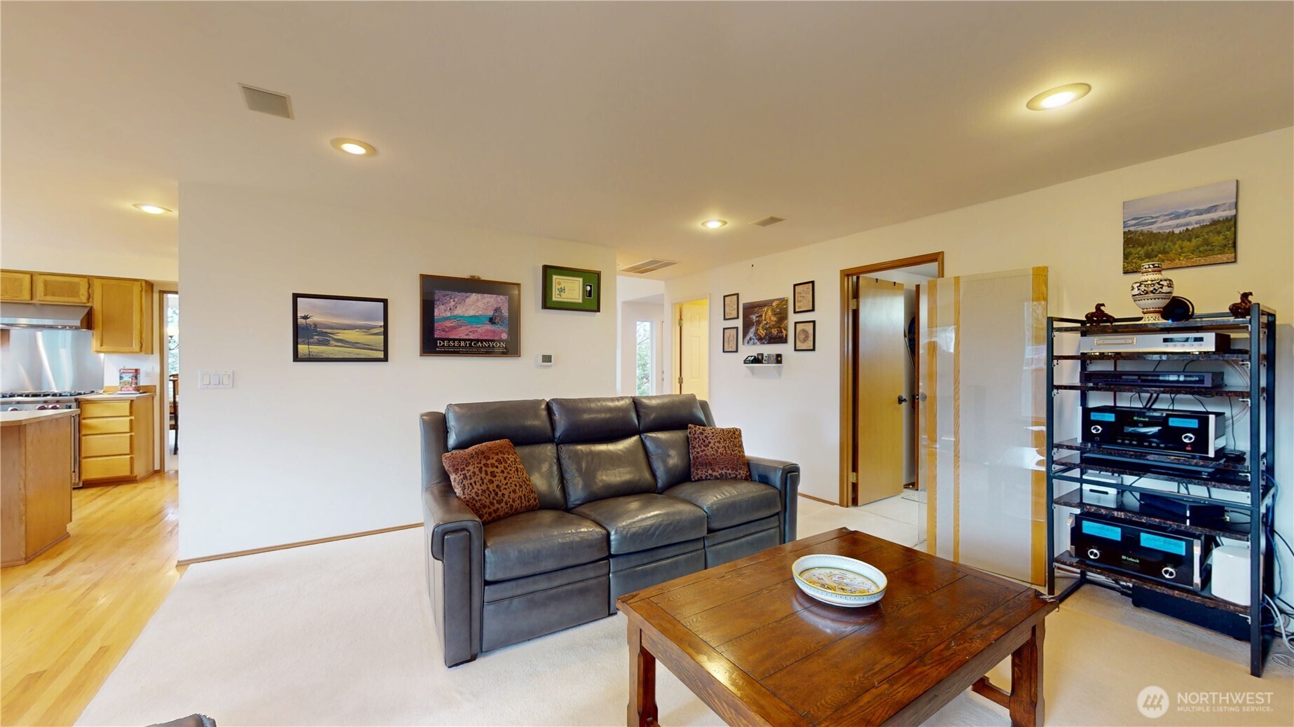 1704 Field Place Northeast Renton, WA 98059 - Photo 14 of 38 a living room with furniture a flat screen tv and a refrigerator
