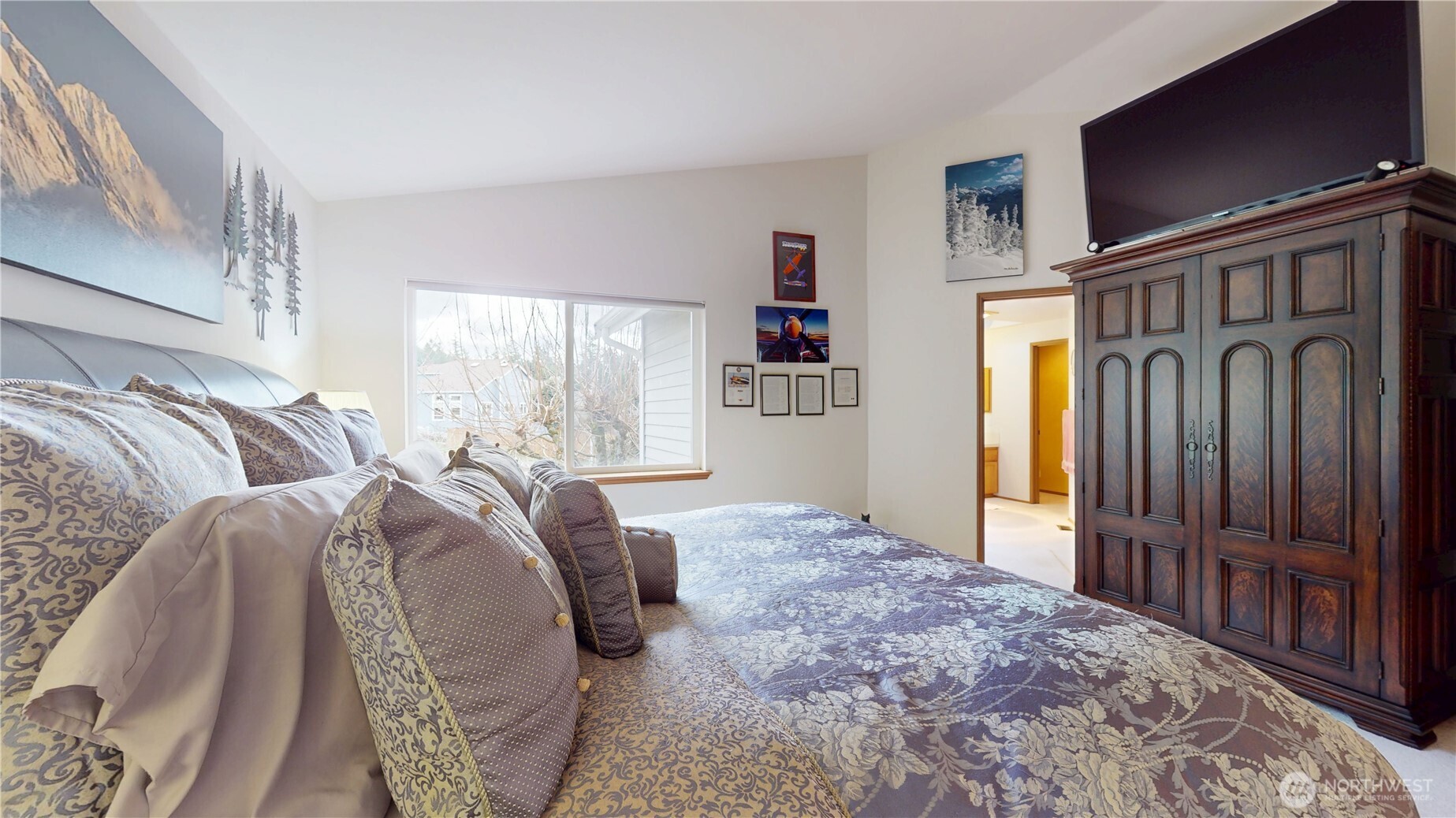 1704 Field Place Northeast Renton, WA 98059 - Photo 19 of 38 a bed sitting in a bedroom next to a window