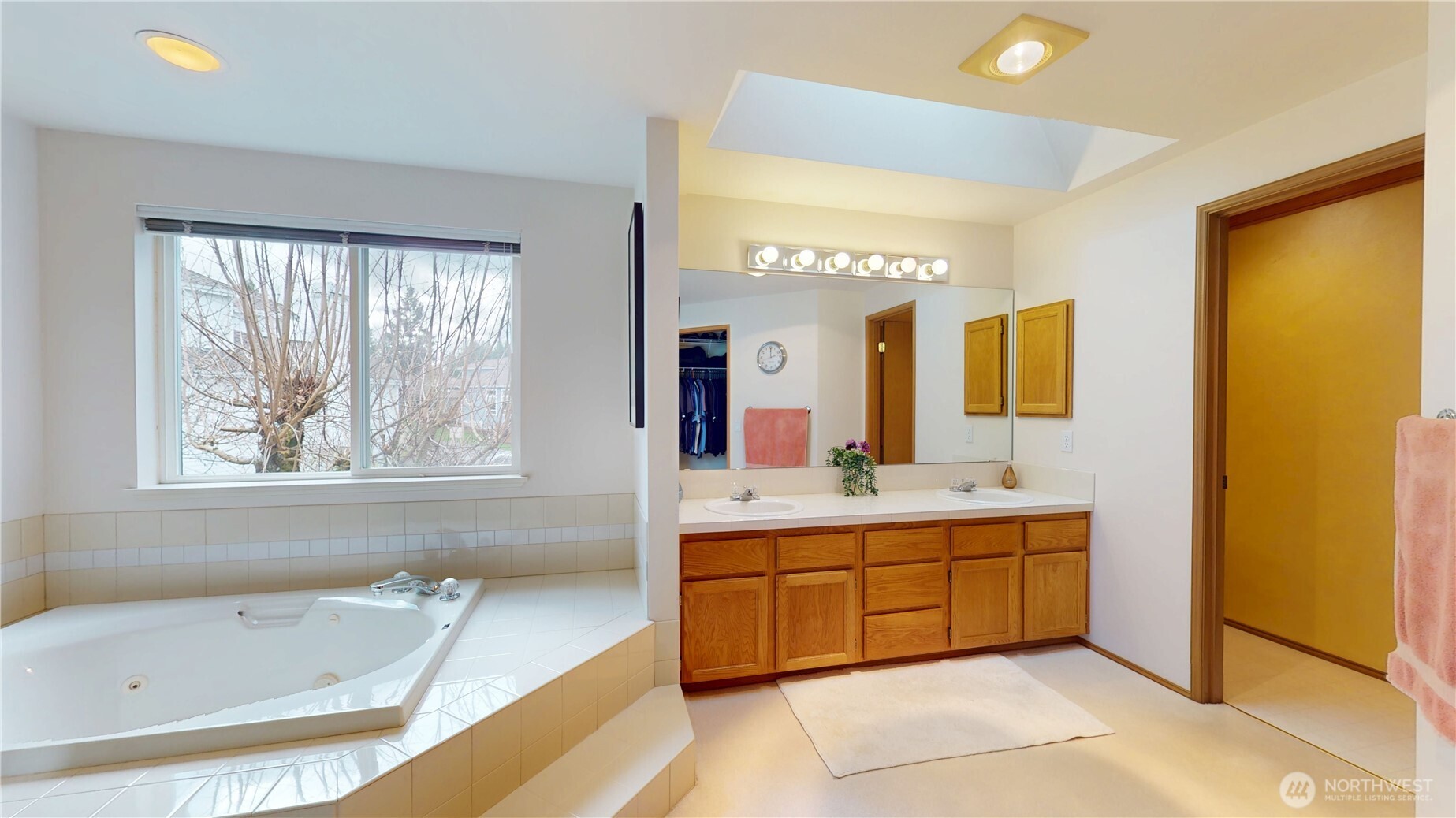 1704 Field Place Northeast Renton, WA 98059 - Photo 20 of 38 a spacious bathroom with a tub sink and mirror