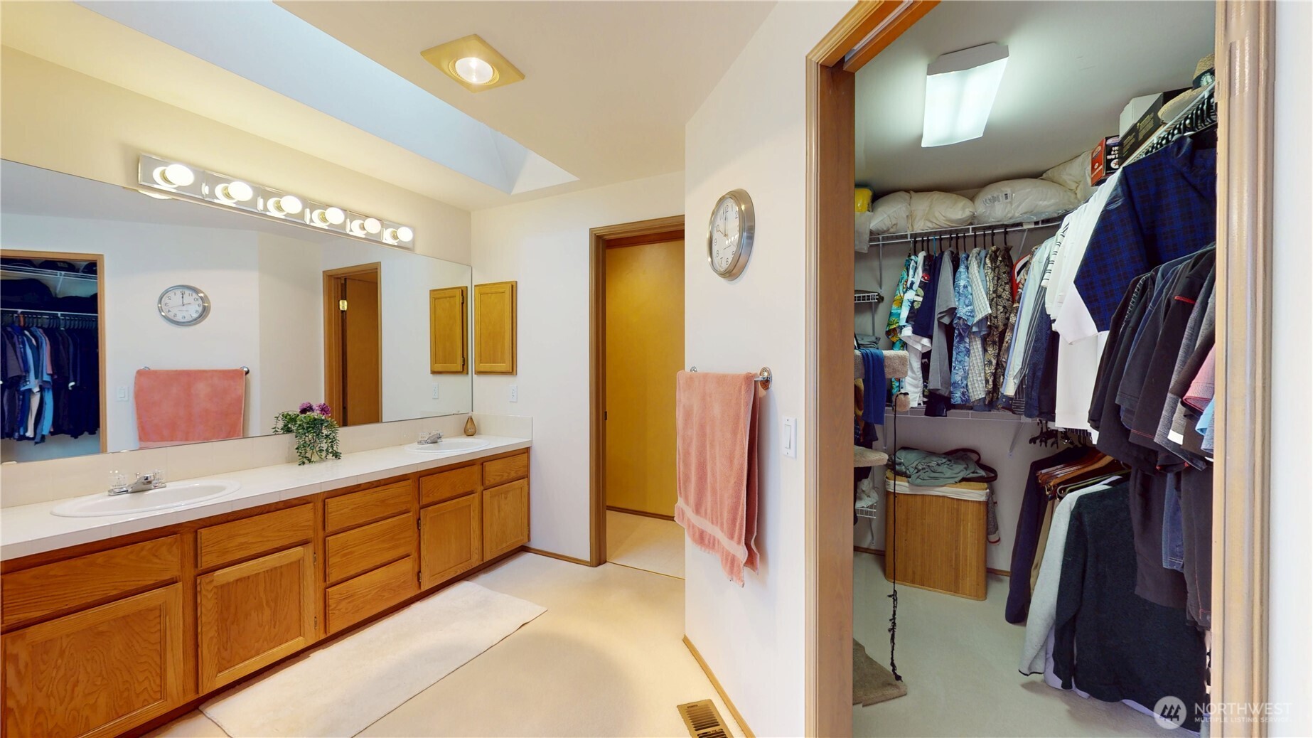 1704 Field Place Northeast Renton, WA 98059 - Photo 21 of 38 a bathroom with a double vanity sink and mirror