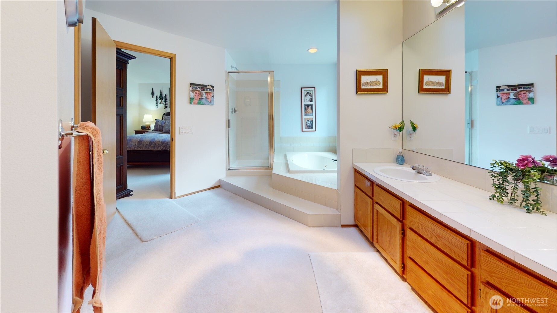 1704 Field Place Northeast Renton, WA 98059 - Photo 26 of 38 a spacious bathroom with a double vanity sink and a large mirror