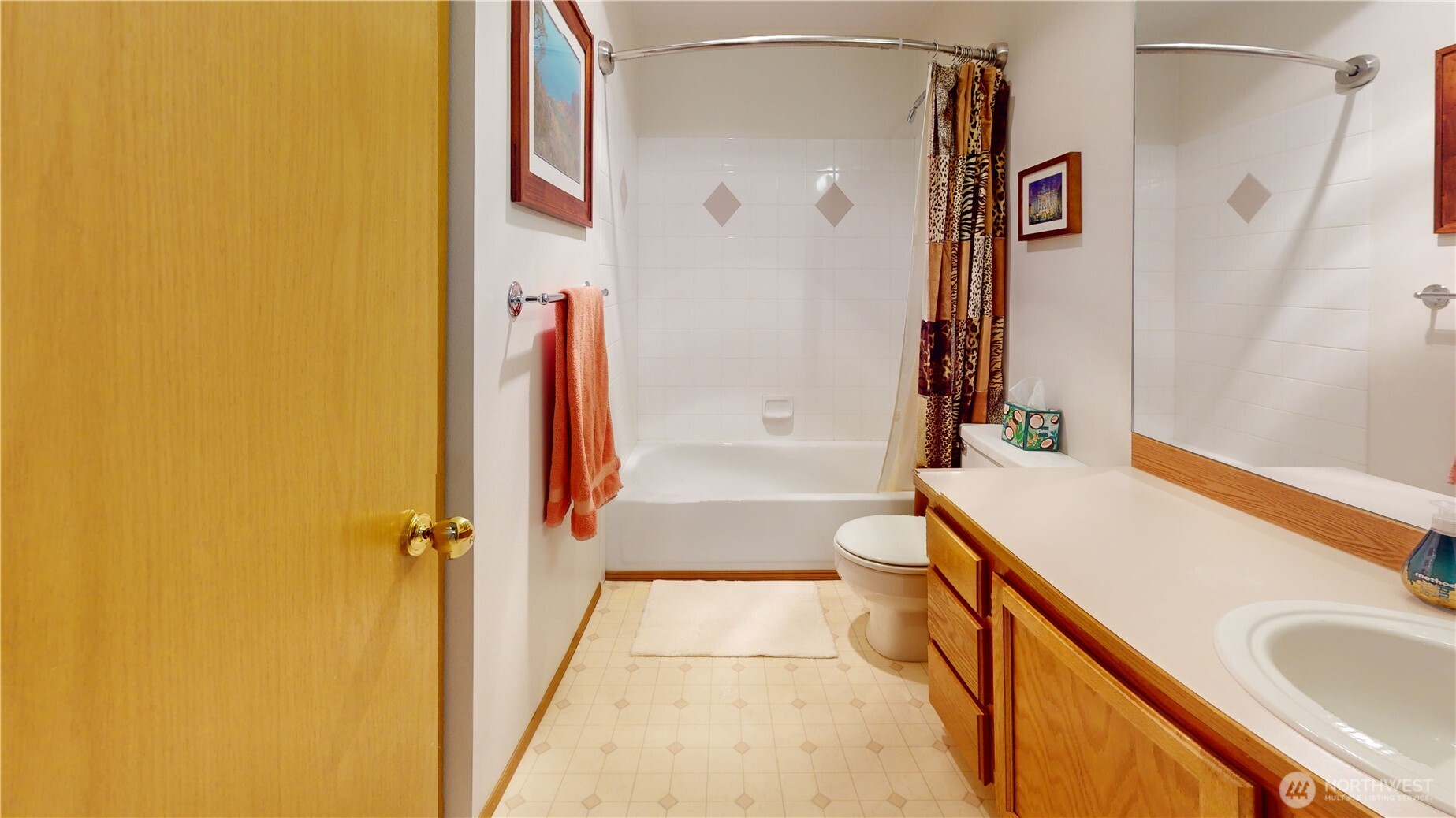 1704 Field Place Northeast Renton, WA 98059 - Photo 27 of 38 a bathroom with a tub sink and mirror