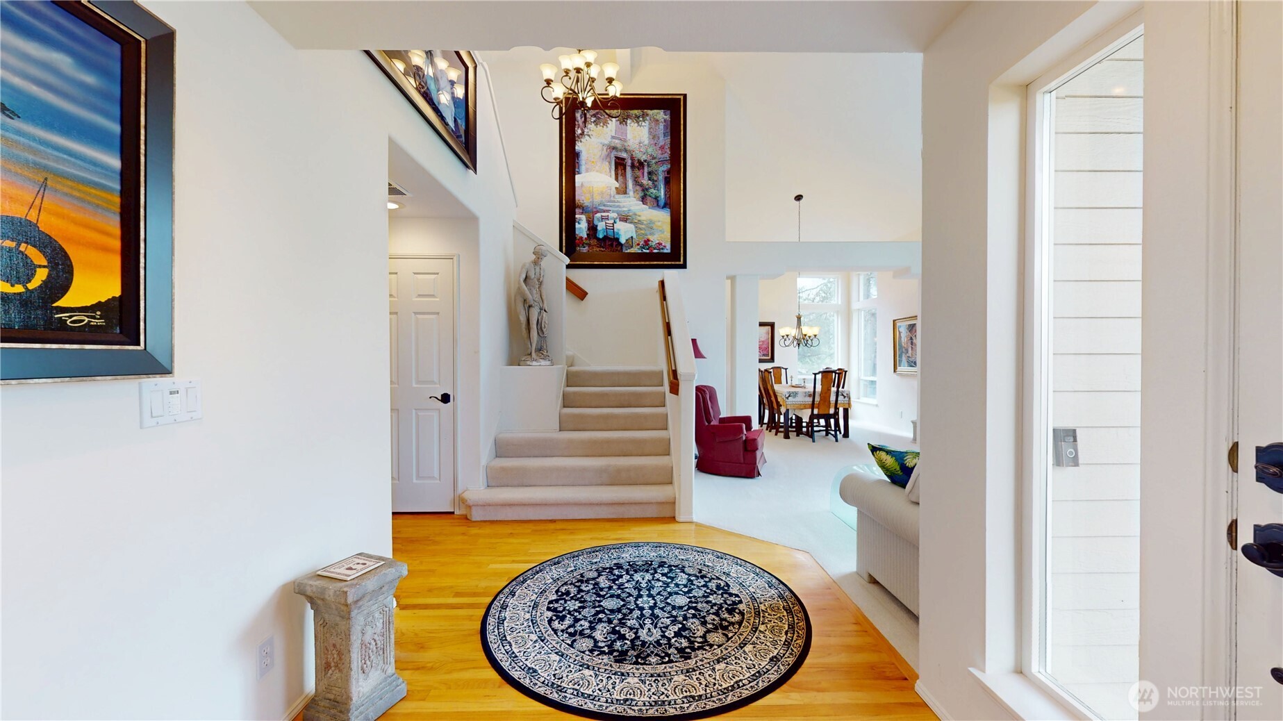 1704 Field Place Northeast Renton, WA 98059 - Photo 6 of 38 hallway with wooden floor and furniture