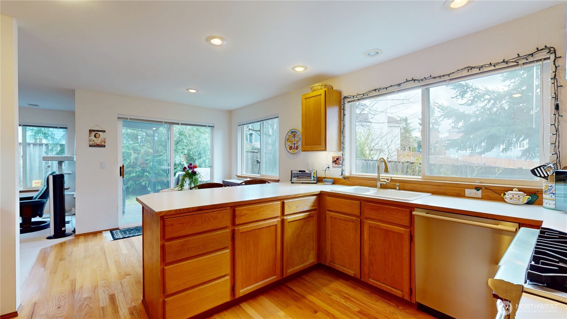 1704 Field Place Northeast Renton, WA 98059 - Photo 9 of 38 a kitchen with a sink and wooden cabinets