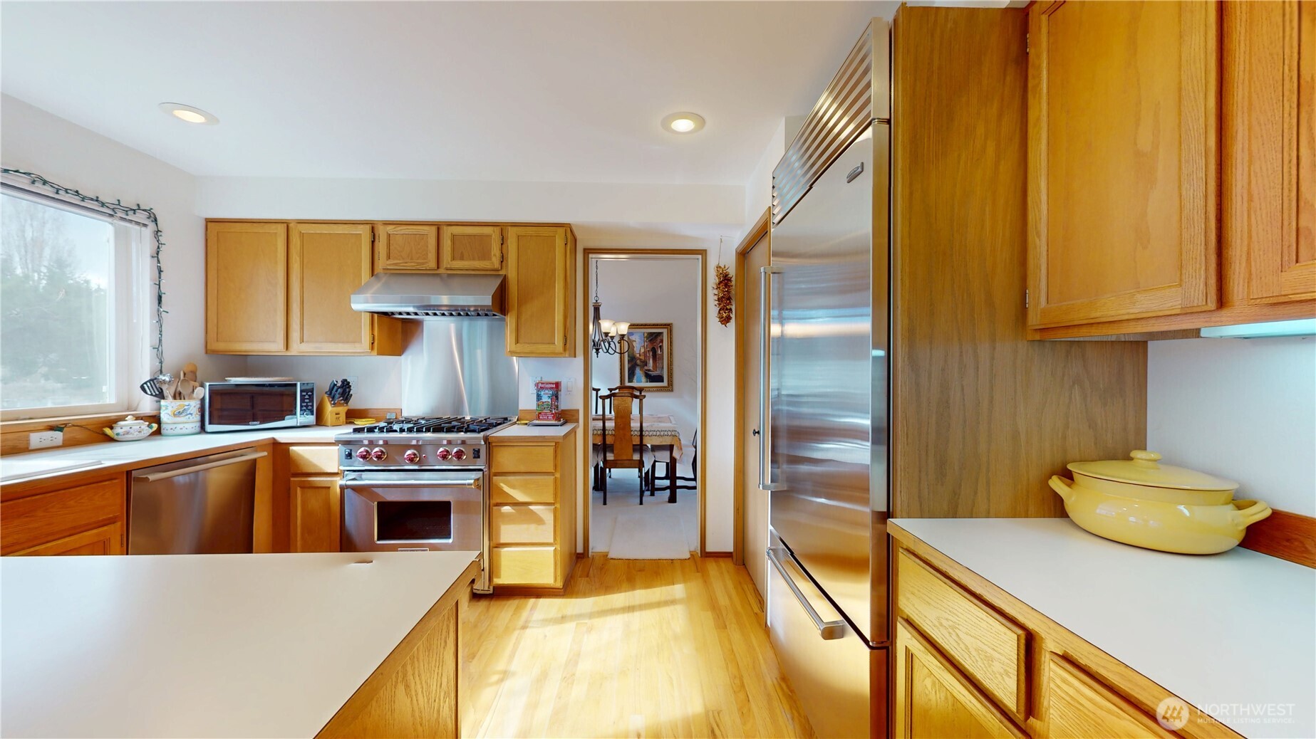 1704 Field Place Northeast Renton, WA 98059 - Photo 10 of 38 a kitchen with stainless steel appliances granite countertop a sink a stove and a refrigerator