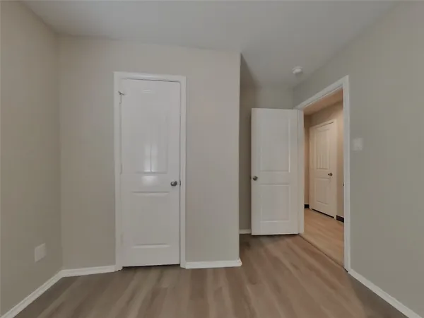 a view of a livingroom with wooden floor