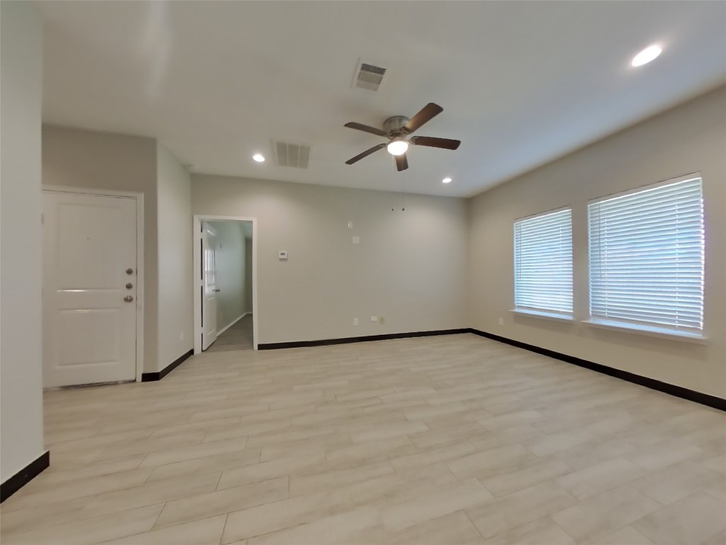 8523 Aster Glen Way Rosharon, TX 77583 - Photo 2 of 15 an empty room with a empty space and a ceiling fan